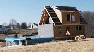 A home mid-way through construction in the early years of Shadowlake Village.