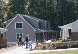 Neighbors come together in a nearly-finished Shadowlake Village community before the last landscaping is finished on the final-few homes.